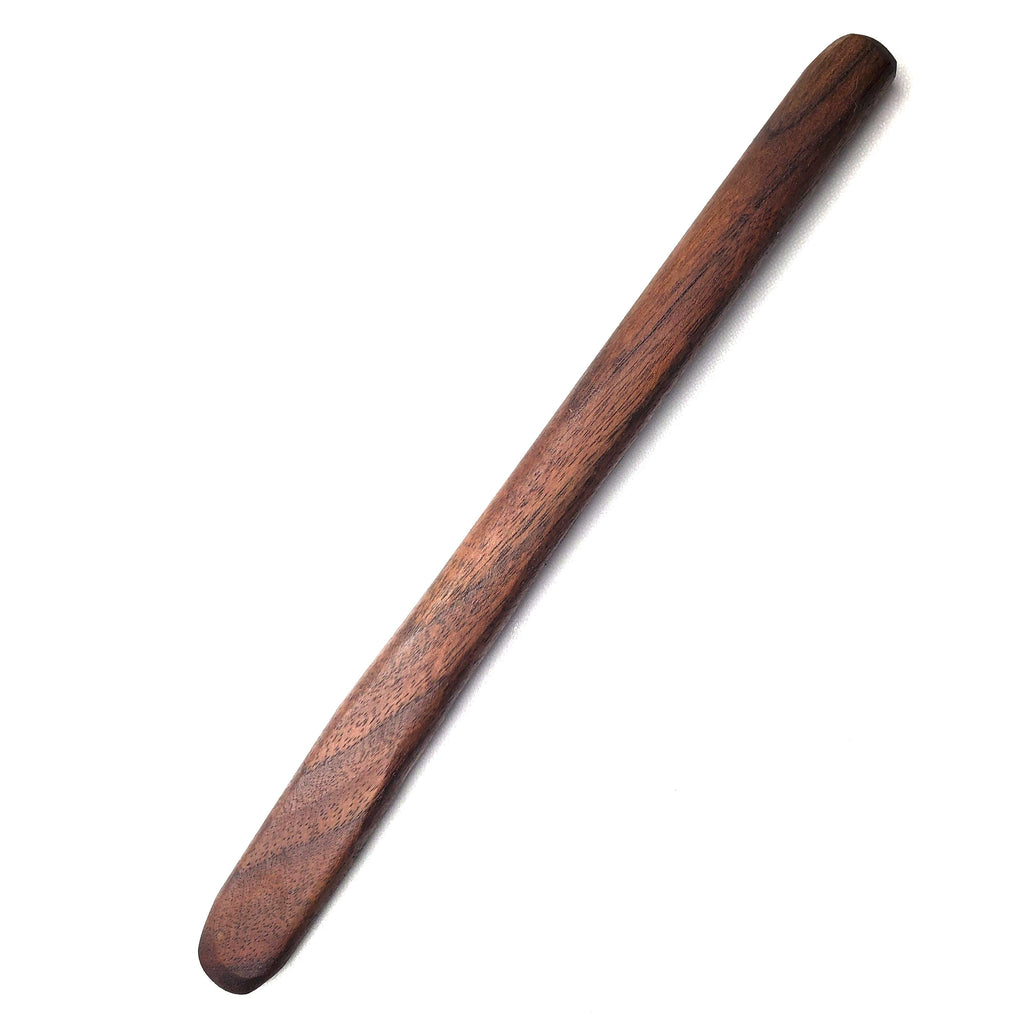 Wooden sourdough mixing stick/spurtle on white background. Walnut wood.